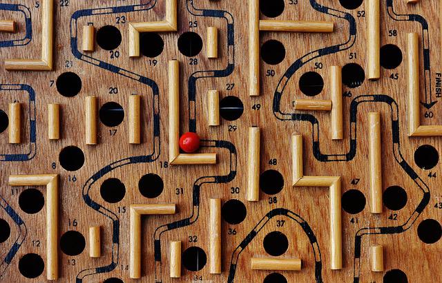 Labyrinth game board with red ball